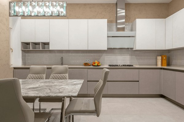 A spacious modern kitchen remodel featuring sleek gray cabinets